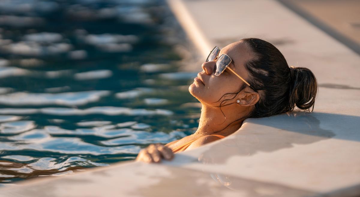 Woman relaxing in San Diego pool