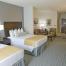 2 Queen Suite With Sealy Pillow Top Mattresses & Deluxe Linens