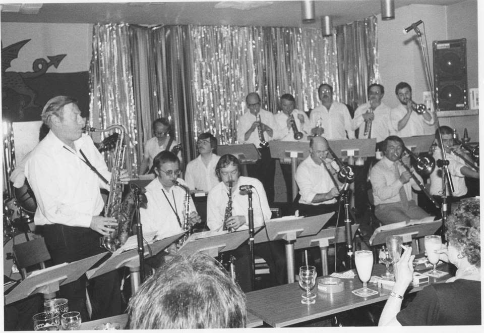 Black and white photo of a jazz band playing in a club in the 1970s.