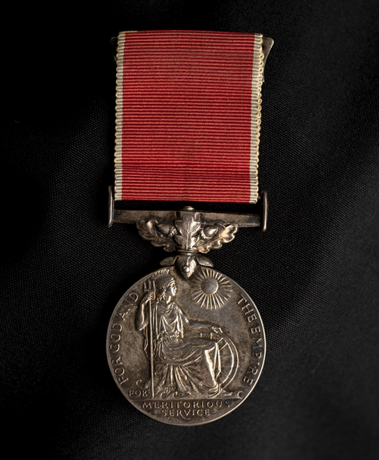 British Empire Medal on a black background.
