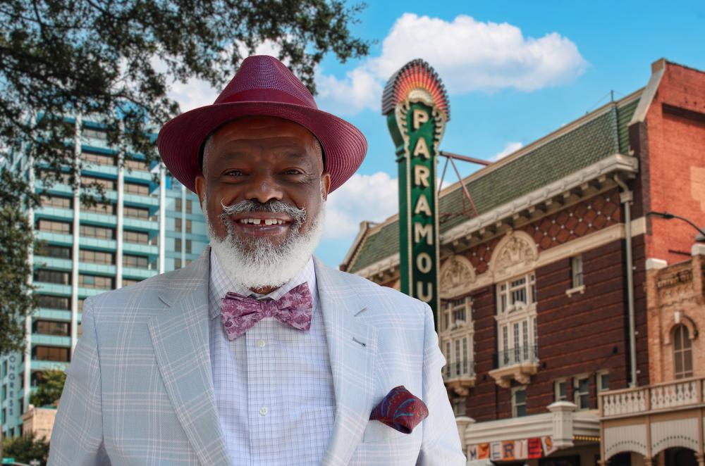 Close up of Harrison Eppright standing in front of the Paramount Theatre in Downtown Austin.