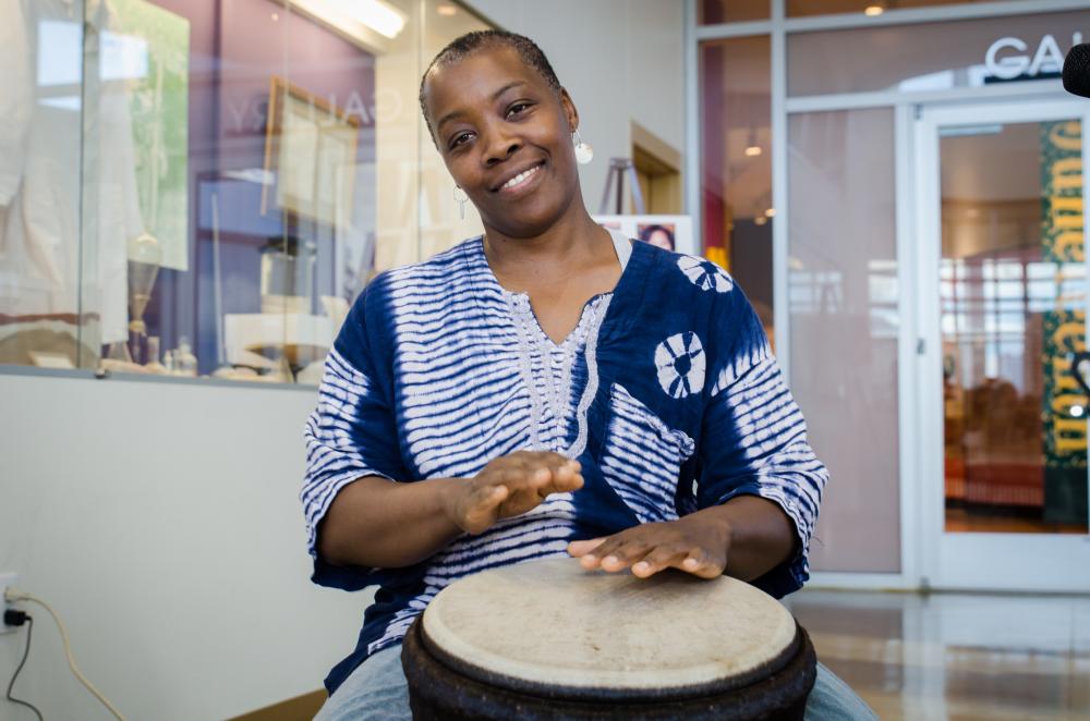 Woman playing drum at the George Washington Carver Museum