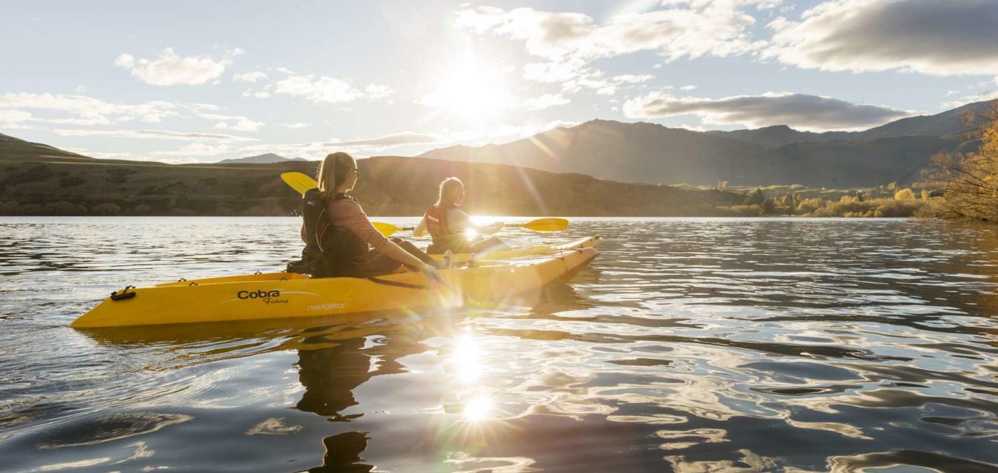 Kayakers paddling Lake Whakatipu in Autumn