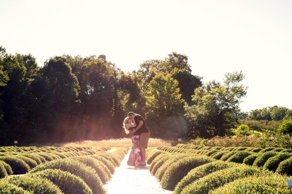 Couple kissing after a successful marriage proposal at Brys Estate in Traverse City