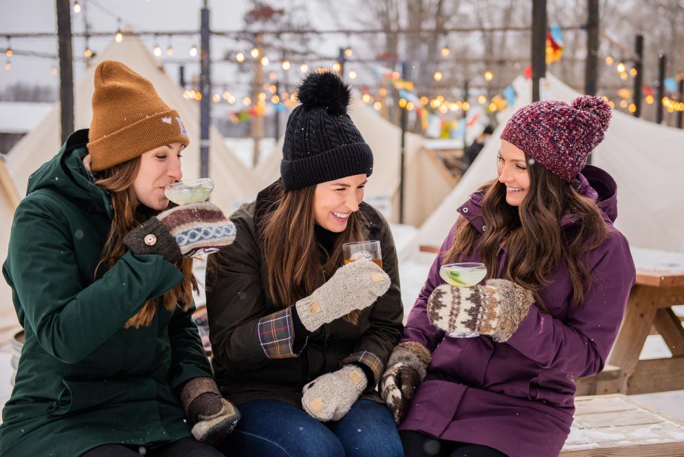 Women Sipping Cocktails at Ironfish Distillery In Traverse City, MI