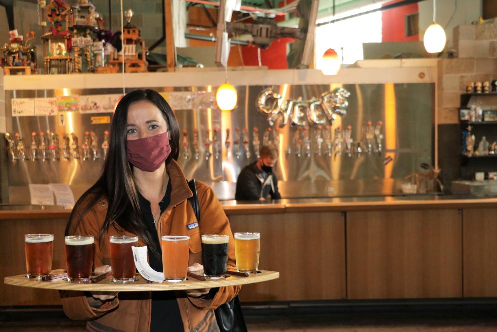 Woman with beer flight at Right Brain