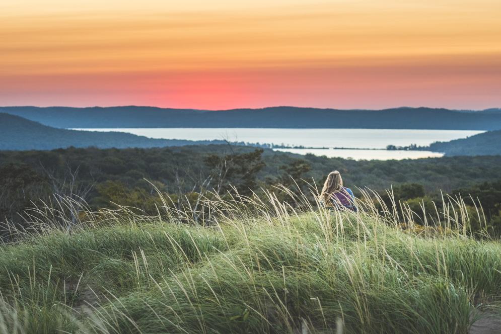 Woman Enjoying The Sunset At Sleeping Bear Dunes Overlook