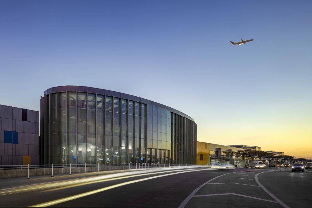 Austin airport east infill with plane flying overhead