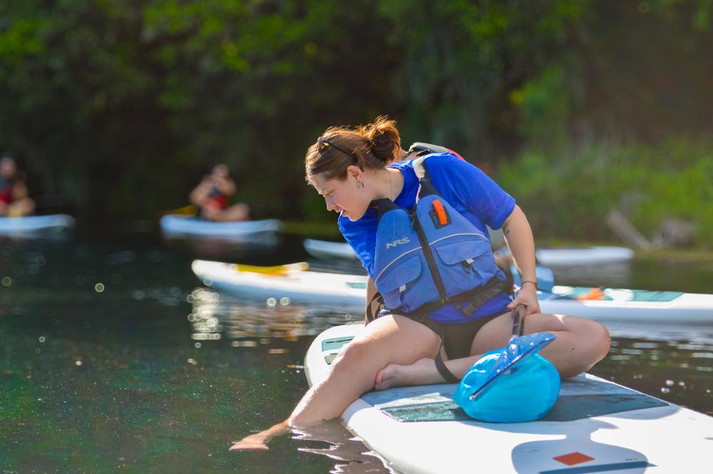A photo of a group of people paddleboarding on Spring Lake in San Marcos, Texas.