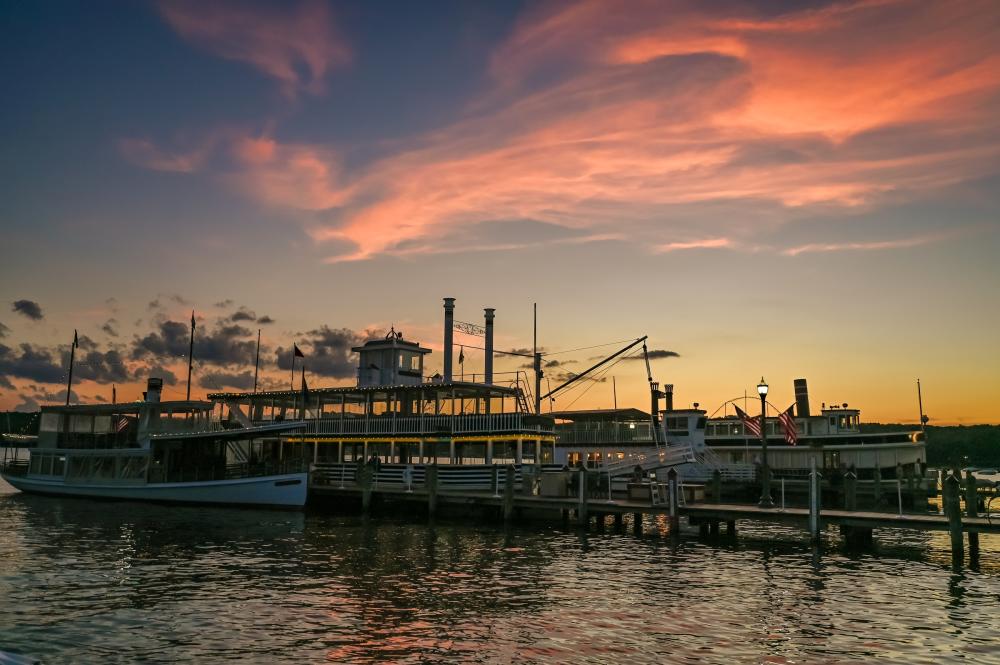 Gage cruise line boats docked at sunset in Lake Geneva.