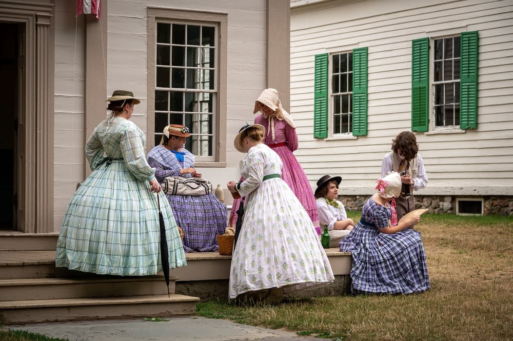 7 interpreters outside a building at Genesee Country Village & Museum