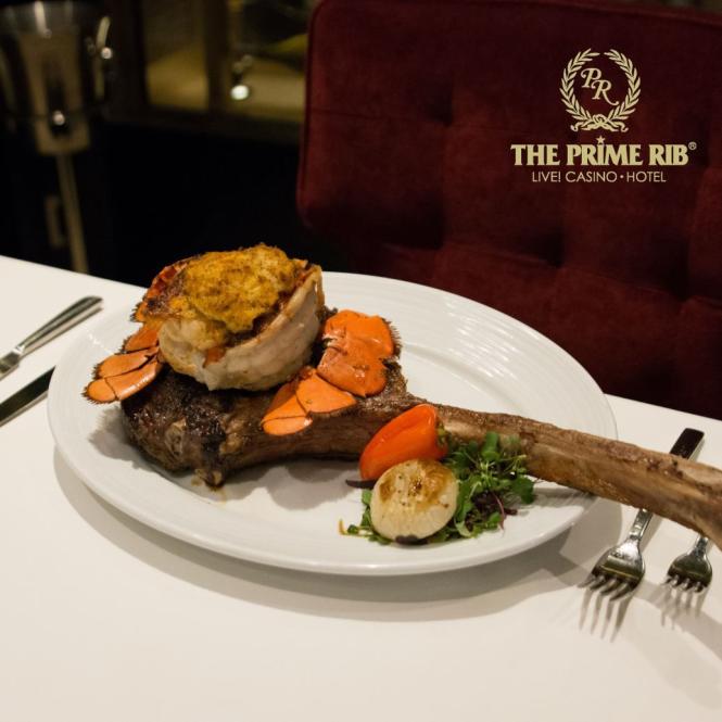 A tomahawk steak chop served with a lobster tail on top