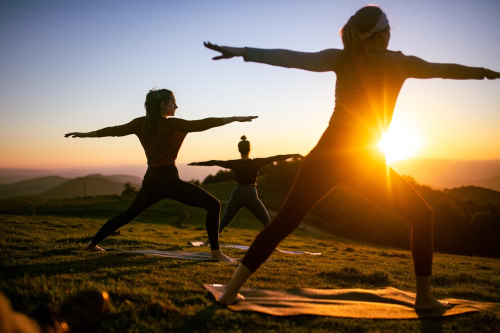Yoga Class Held at Sunset on Mountaintop