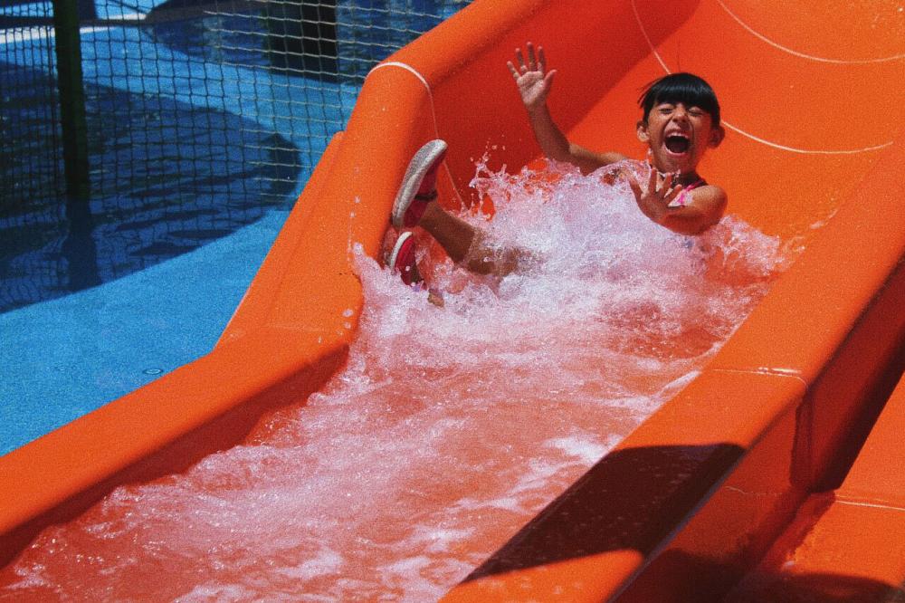 Child on water slide at Camp Fimfo New Braunfels