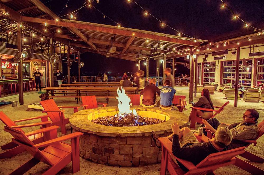 fire pit at night at Oasis Texas Brewing Company in austin texas