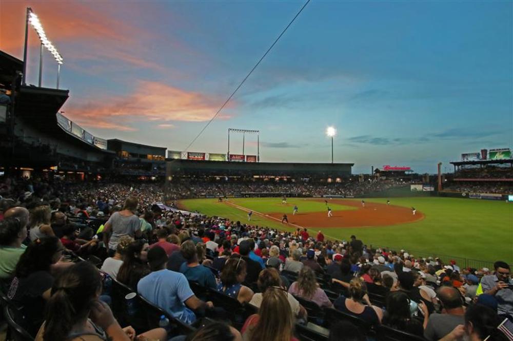 People in the stands at Dell Diamond watching the Round Rock Express baseball team.
