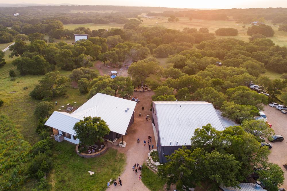 Aerial photo of the Vista Brewing property with two large buildings and a large outdoor space.