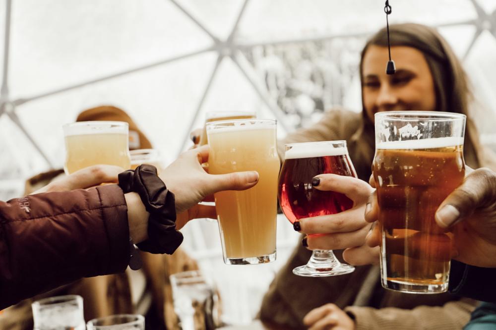 People holding glasses of beer