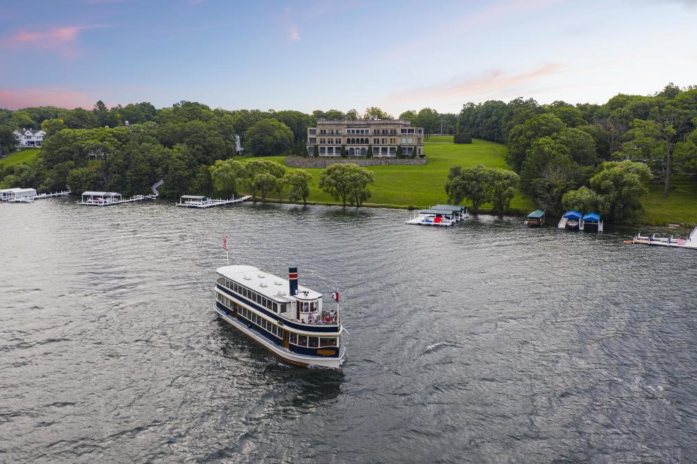 Boat cruising by Stone Manor