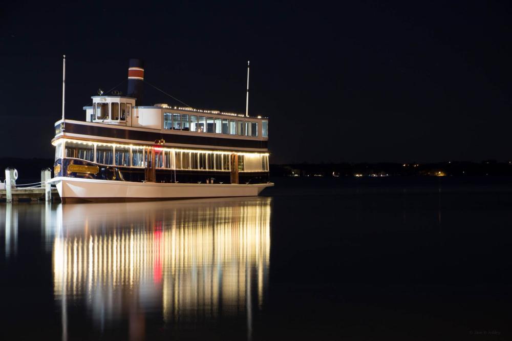 The Grand Belle boat at night on Geneva Lake