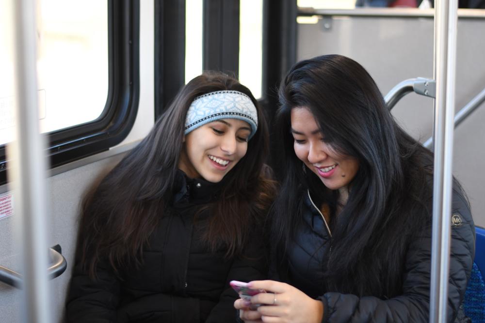 two women riding a bus