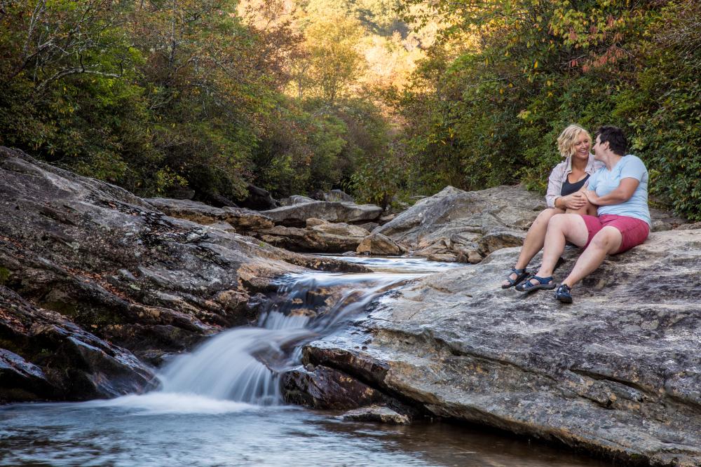 A couple enjoys a scenic cascade