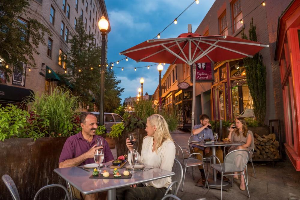 Two Social Diastanced couples having a meal outside