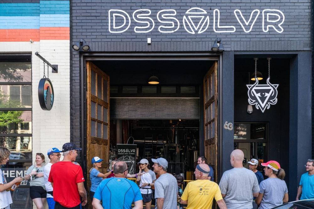 Running group meeting outside of Dissolvr Brewing