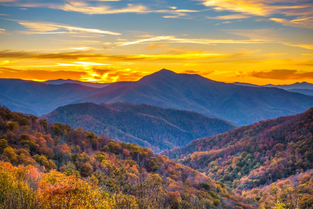Sun sets over Cold Mountain during fall