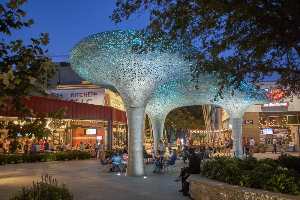 Al fresco dining beneath mushroom-shaped light sculptures at Domain