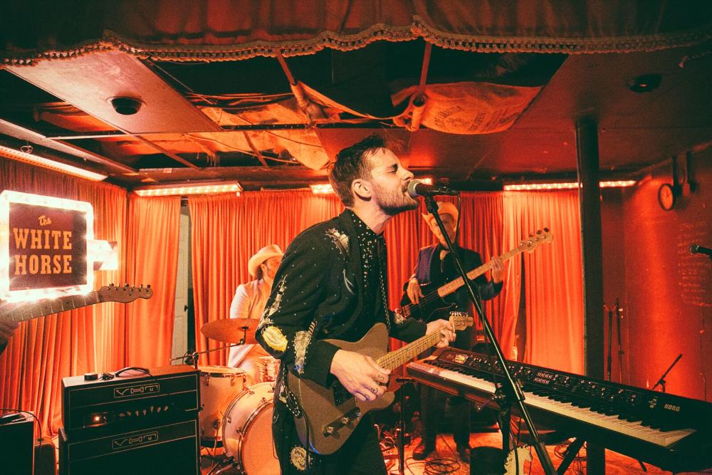 Robert Ellis and band playing live music at the White Horse during Hot Luck Live Food & Music Festival in Austin Texas