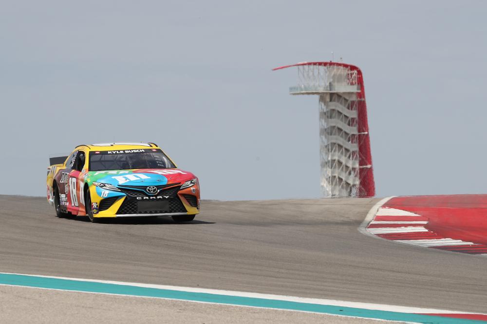 toyota camry nascar race car on circuit of the americas track in Austin Texas with tower in the background