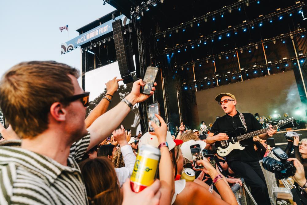 Photo of Cage the Elephant performing in the pit with festival goers at ACL Fest.