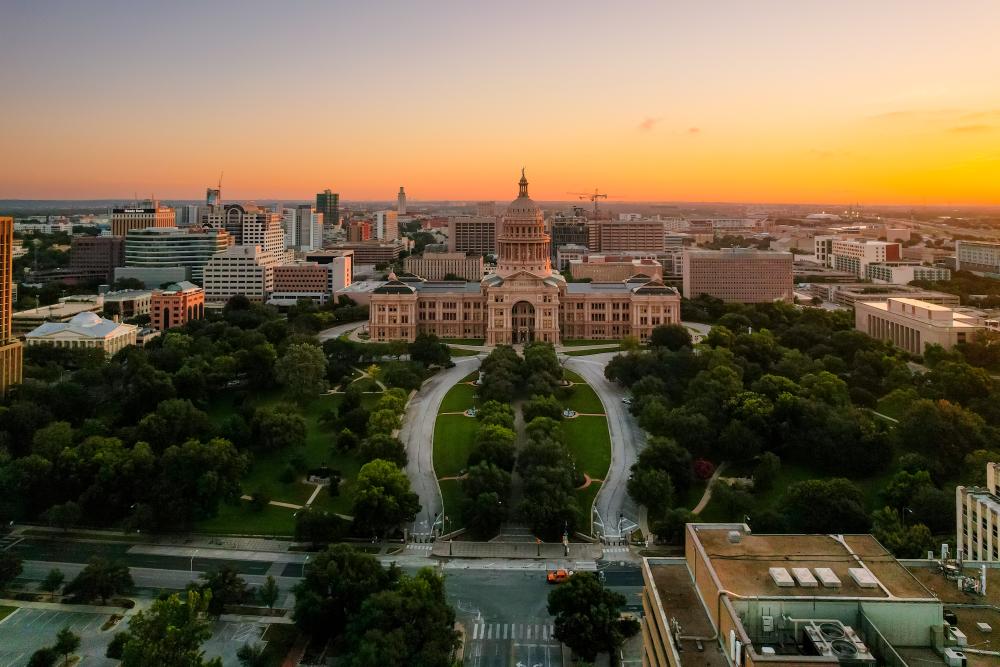 Sunrise aerial view of the Texas State Capitol grounds.