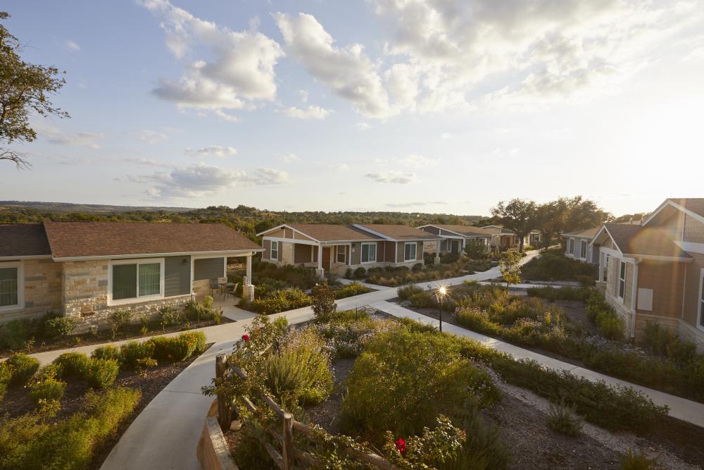 Photo of six villas with landscaping and paved walkways at Courtesy of Carter Creek Winery Resort & Spa