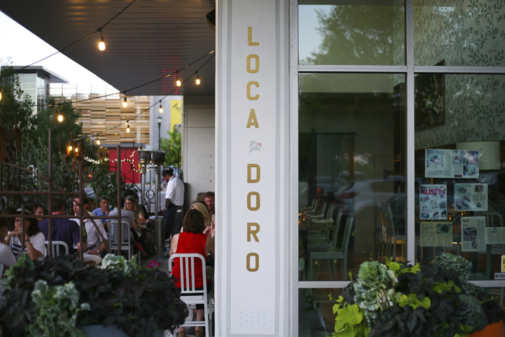 Diners on the patio at  L oca d Oro restaurant in Austin Texas