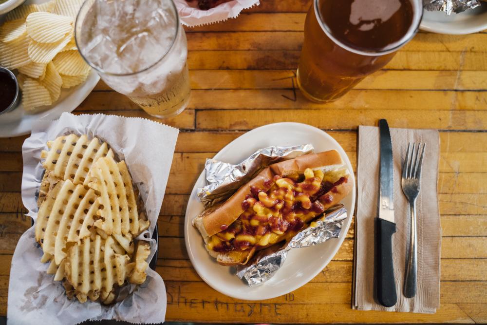 Bratwurst waffle fries and beer from Scholz Garten in Austin Texas