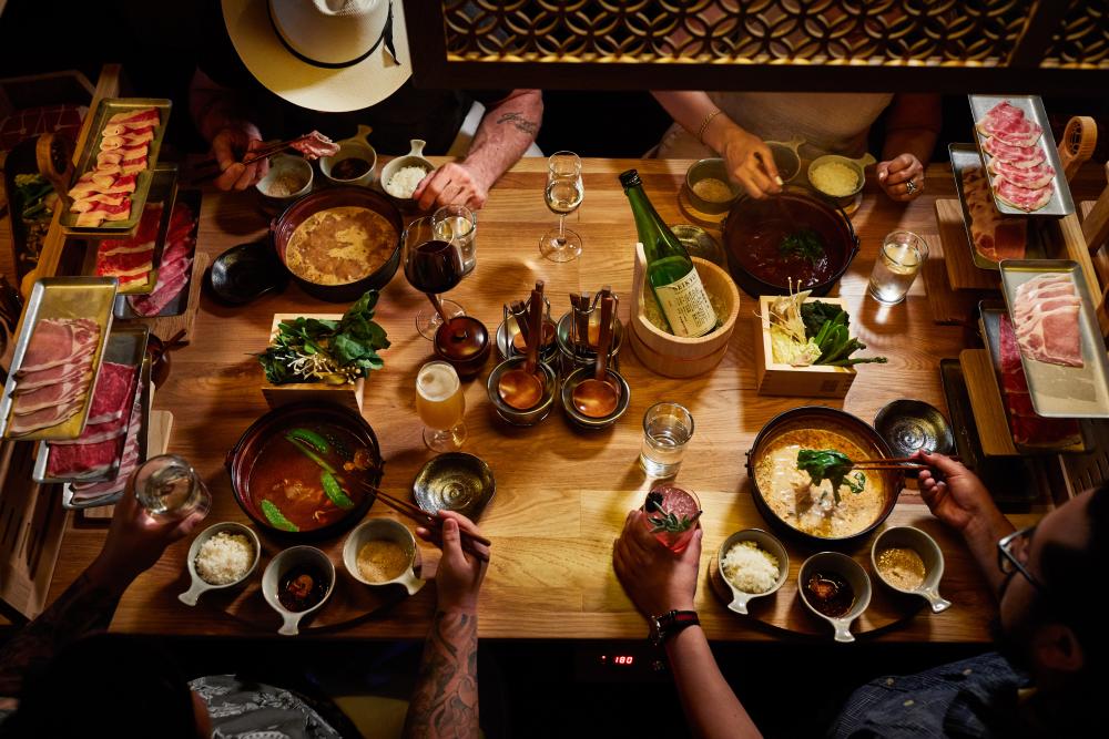 people around table at japanese shabu shabu restaurant Dipdipdip Tatsu ya in austin texas