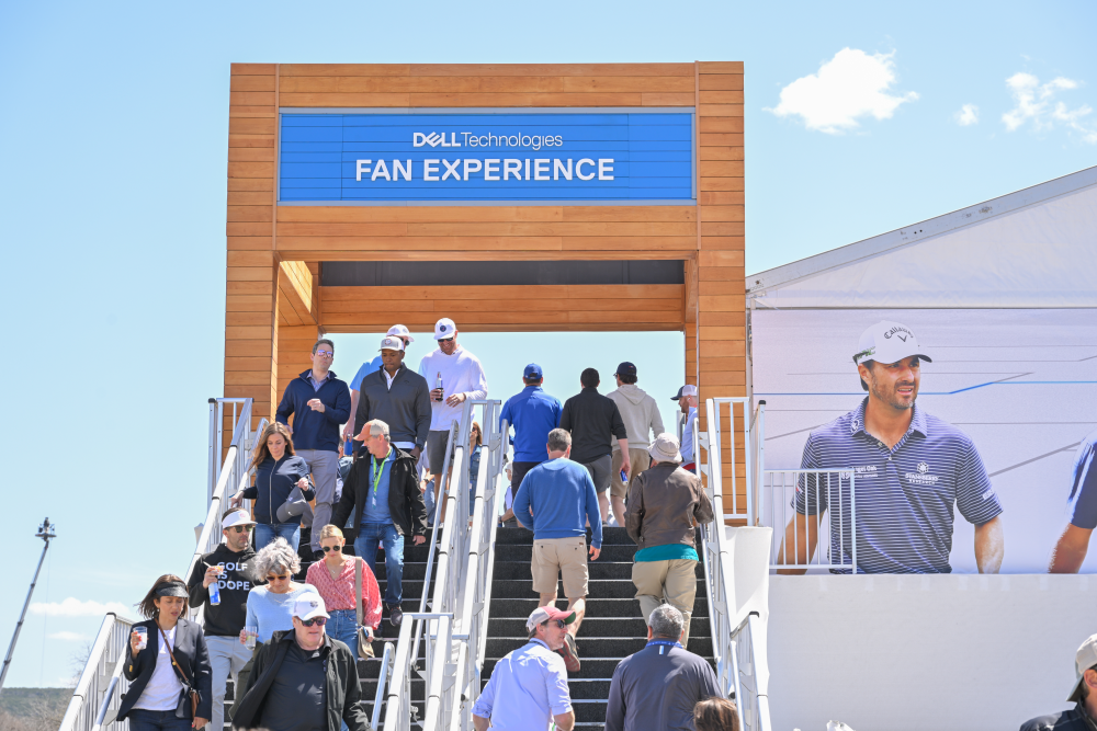 Fans walking up and down stairs at the Dell Technologies Match Play Fan Village.
