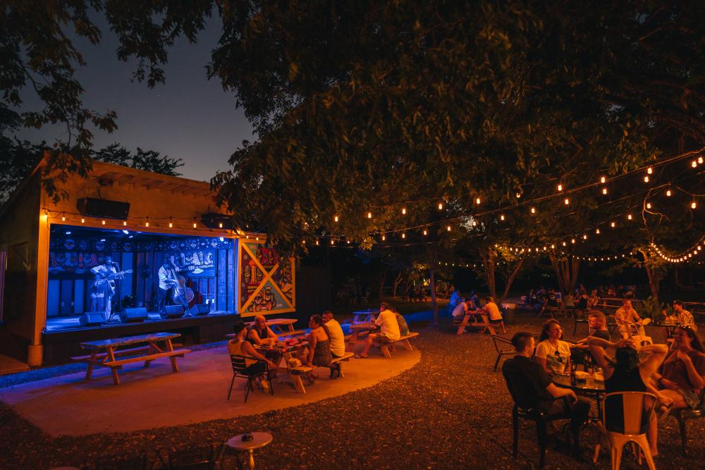 Band performs on outdoor stage at Far Out Lounge in Austin Texas