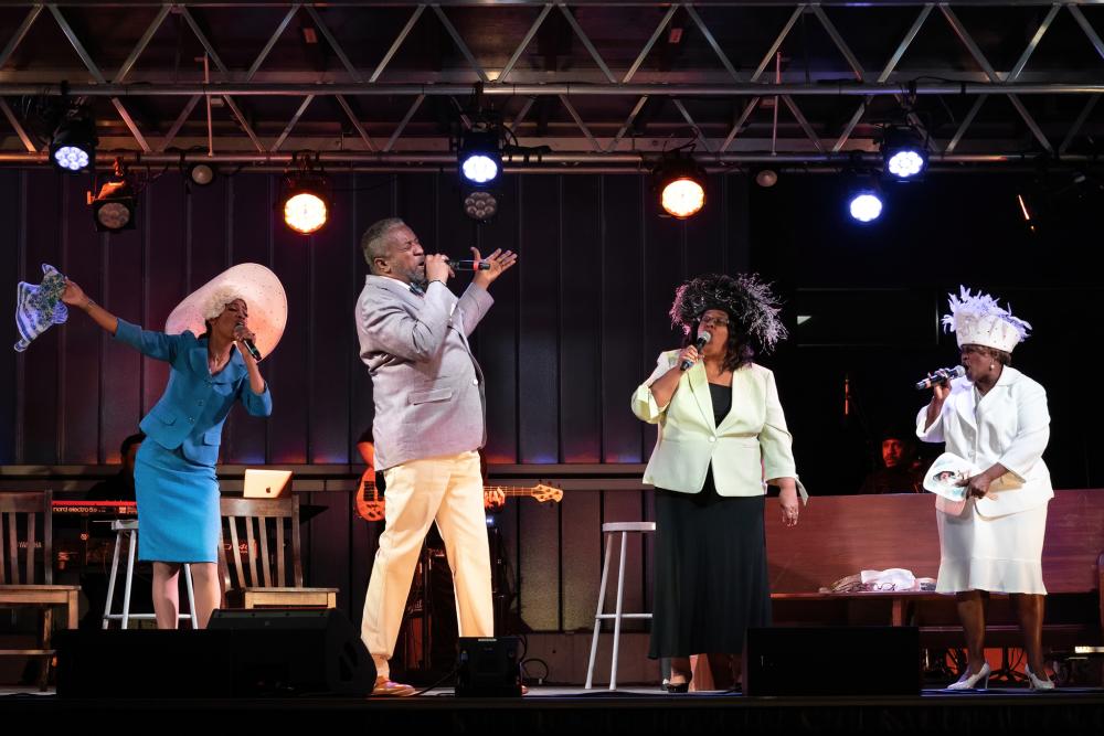 Four performers sing at the Gospel Down By The Riverside show at ZACH Theatres Songs Under the Stars Series in Austin Tx