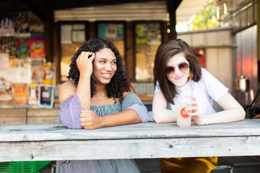 Two women sitting at the bar at Jos Coffee on South Congress Avenue In Austin, TX