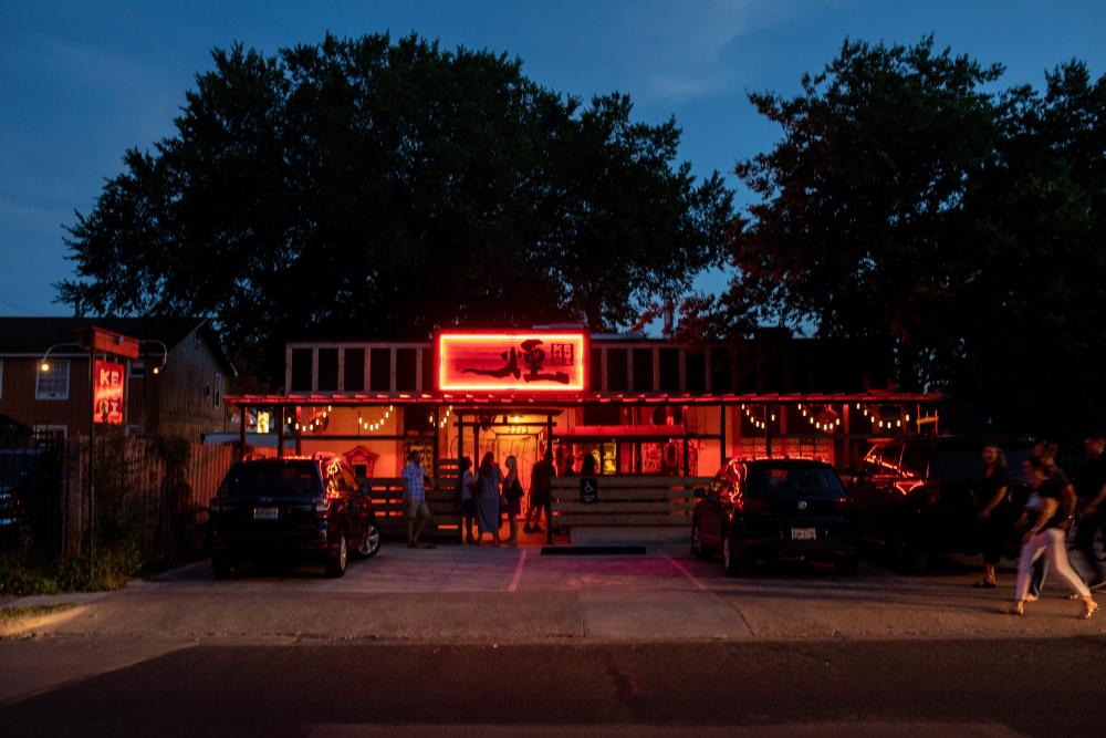 Exterior of Kemuri Tatsu ya restaurant at night in Austin Texas