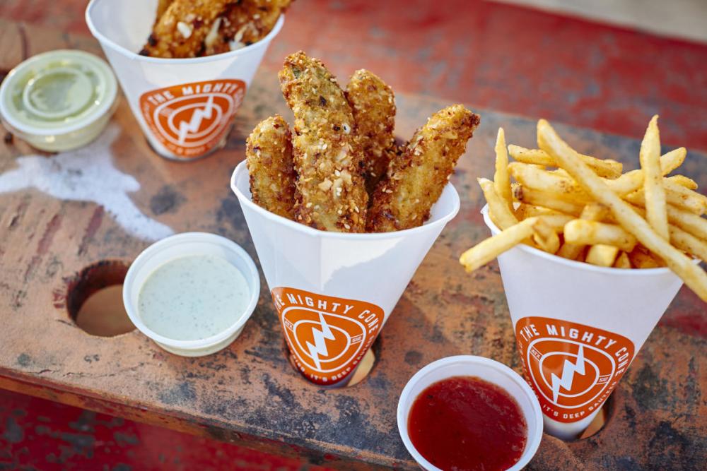 Fried chicken and french fries in a Mighty Cone cone cup.