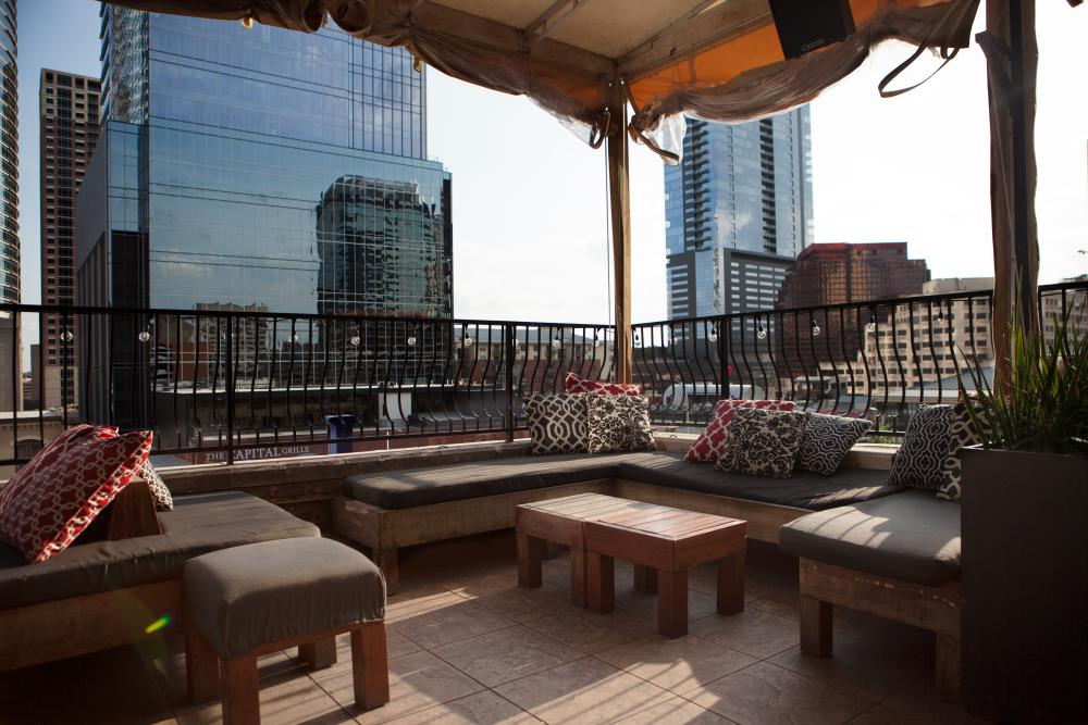 Rooftop patio at Speakeasy bar overlooking downtown Austin