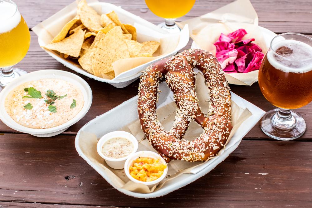 pretzels and queso and beer from Roughhouse Brewing in San Marcos Texas