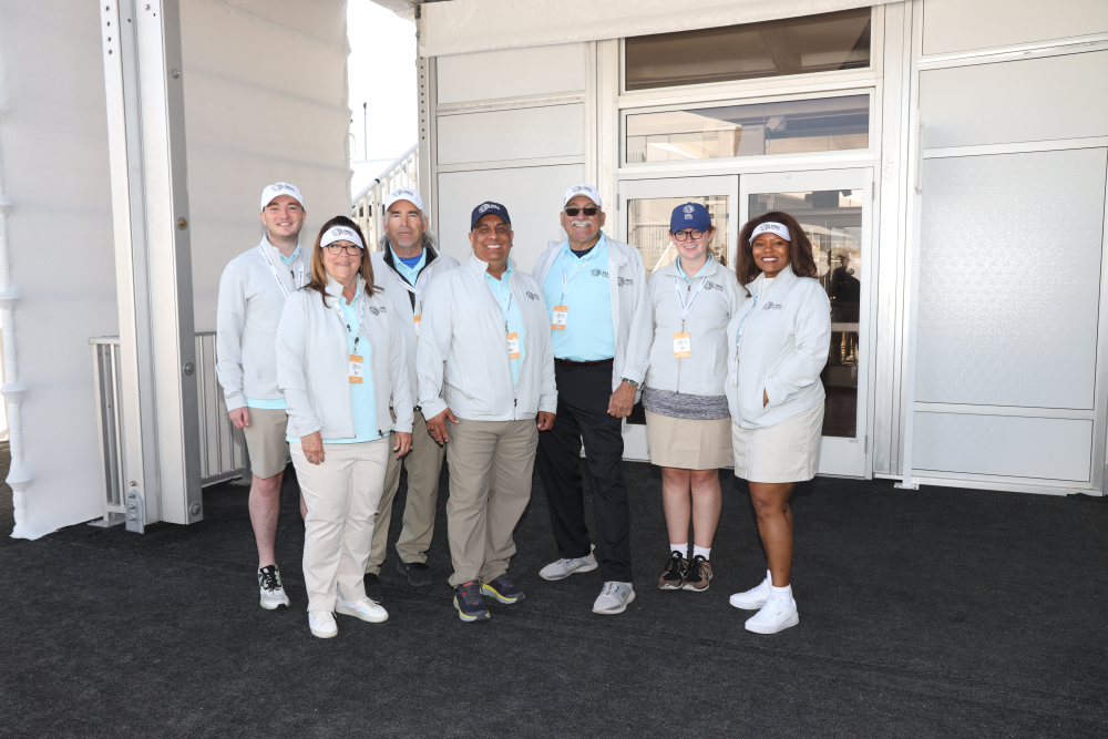 Volunteers in matching golf attire at Dell Technologies Match Play.