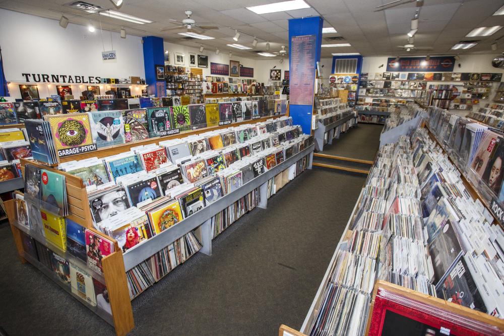 Store interior with rows of vinyl and CDs at Waterloo Records in Austin Texas