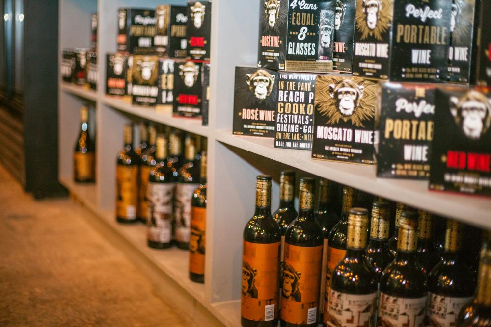 Wine bottles and cans on shelf at Infinite Monkey Theorem in austin texas