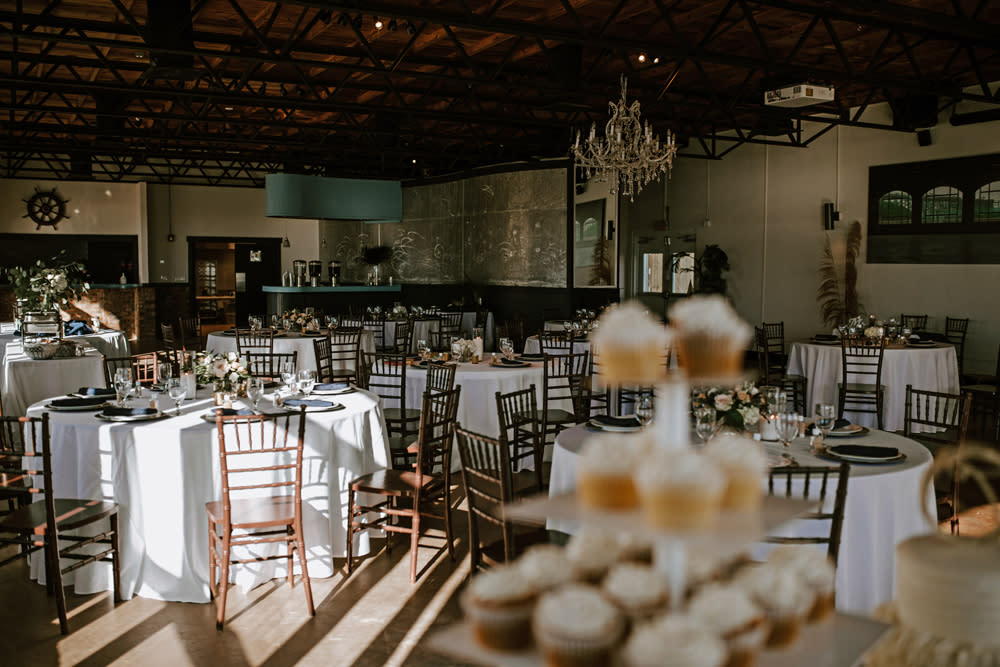 room with tables decorated for a wedding reception